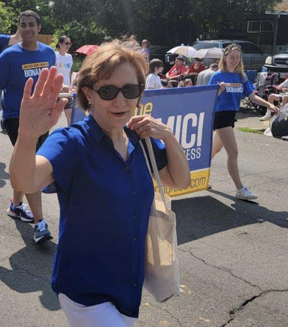 Democracy summer scholars marching with Suzanne in a parade